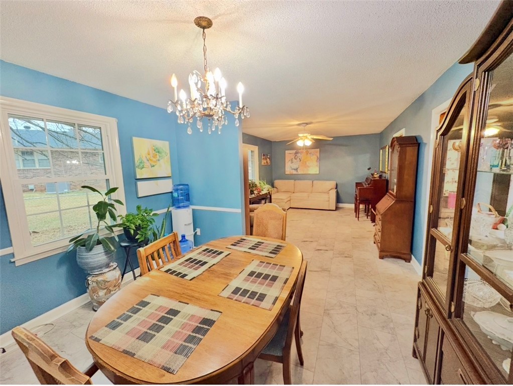 402 Loblolly Drive Anderson, SC 29625 - Photo 9 of 43 This inviting dining area seamlessly connects to a cozy living space, perfect for gatherings.