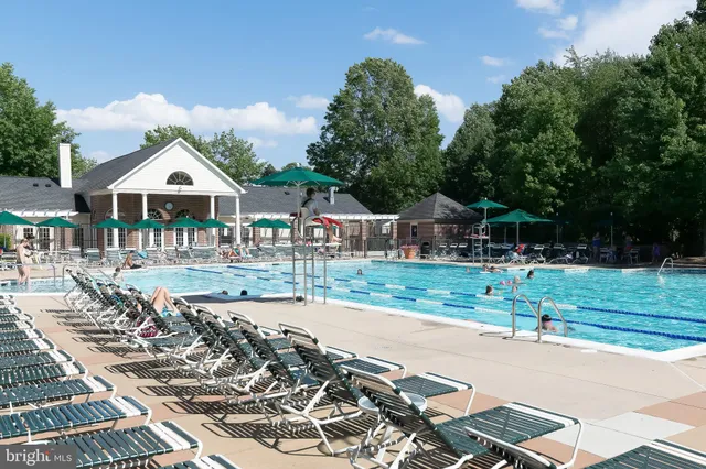 a front view of a house with a yard table and chairs