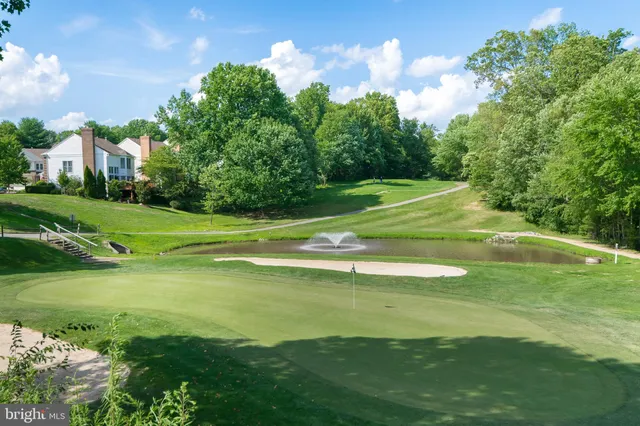a view of a golf course with a lake