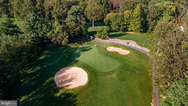 a swimming pool with trees in the background