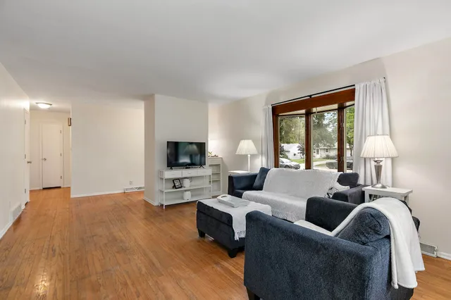 a kitchen with stainless steel appliances granite countertop a sink and a refrigerator