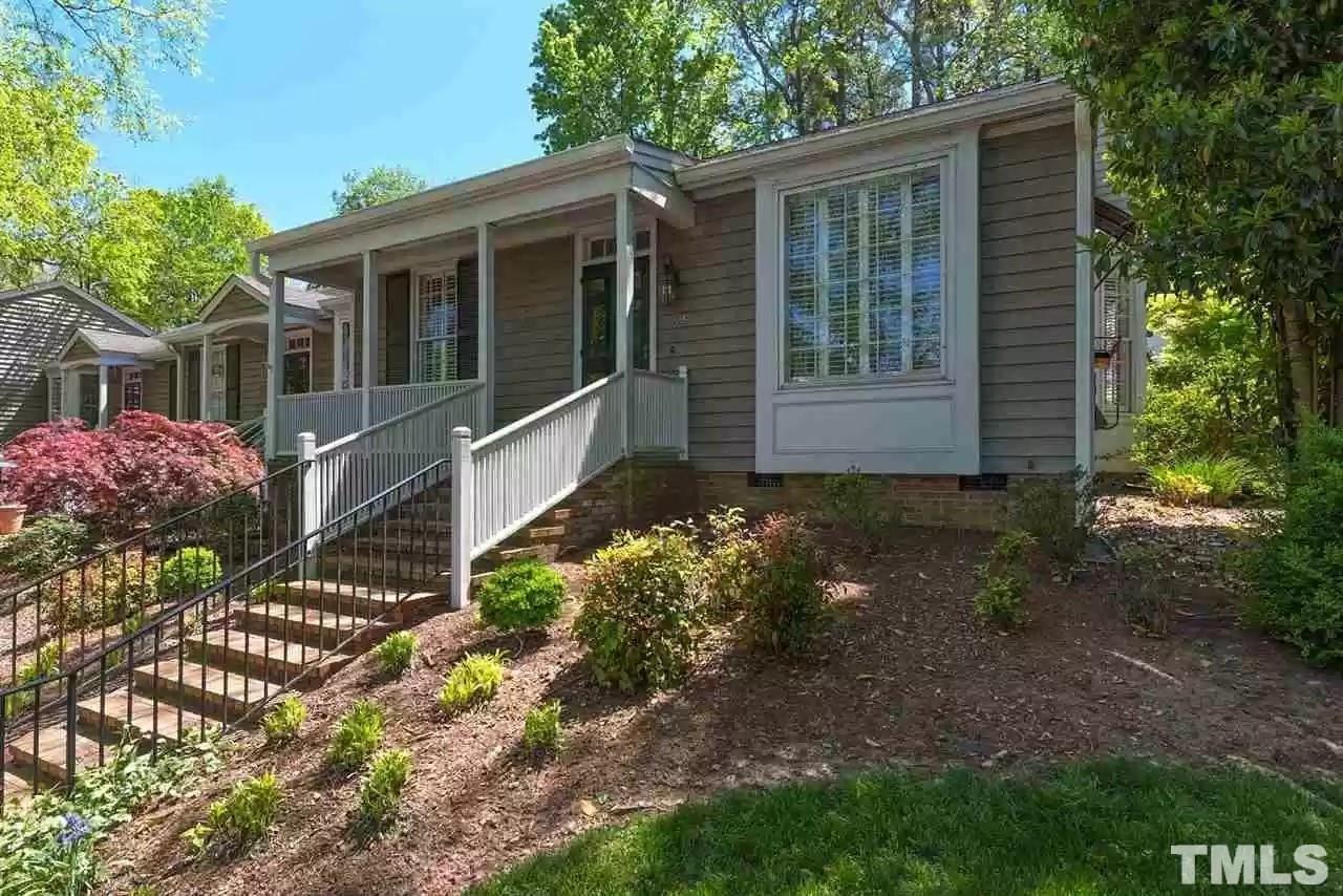 2625 Ashland Street Raleigh, NC 27608 - Photo 1 of 26 a front view of a house with garden