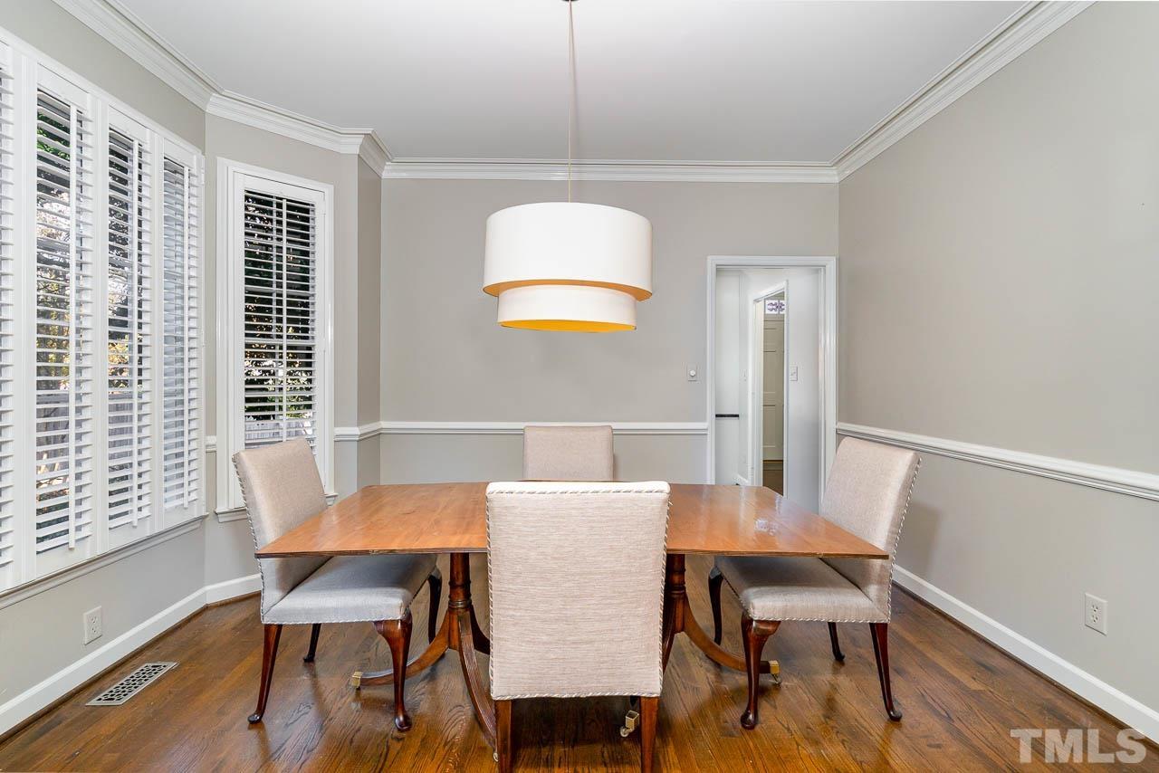 2625 Ashland Street Raleigh, NC 27608 - Photo 11 of 26 a view of a dining room with furniture and wooden floor
