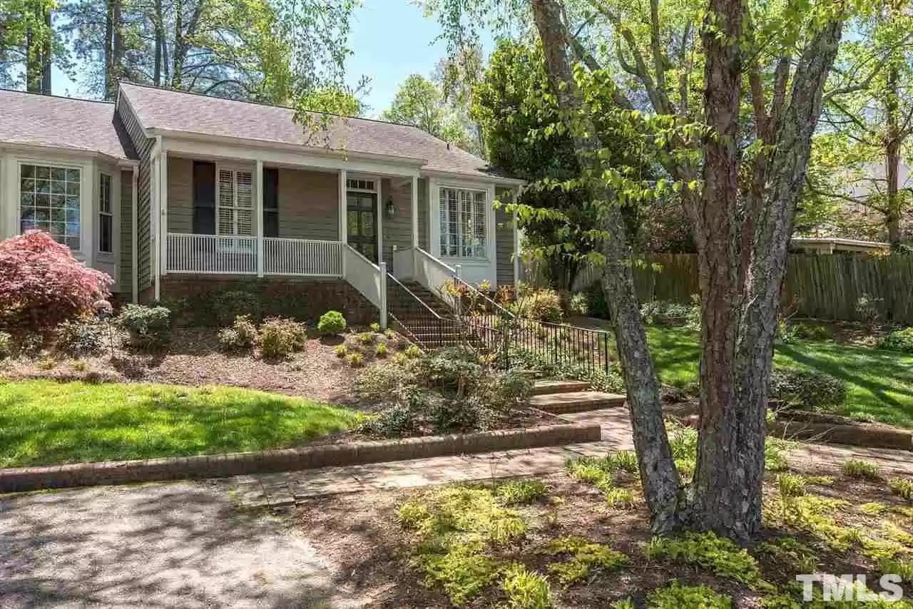 2625 Ashland Street Raleigh, NC 27608 - Photo 2 of 26 a front view of a house with a yard and potted plants