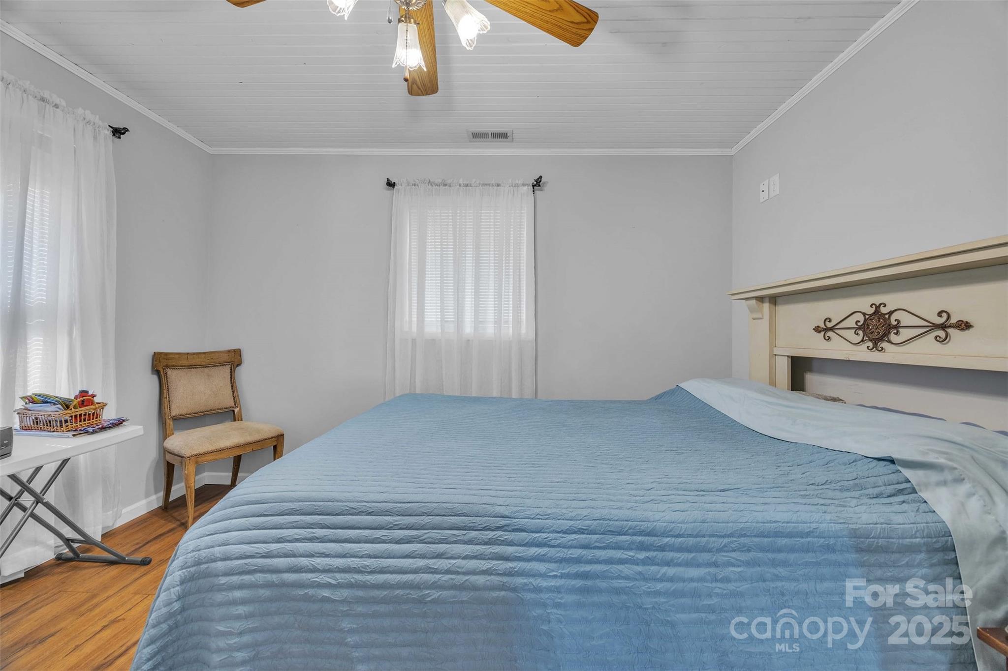 5158 Jenkins Road Morganton, NC 28655 - Photo 24 of 40 a bedroom with a bed and painting on the wall