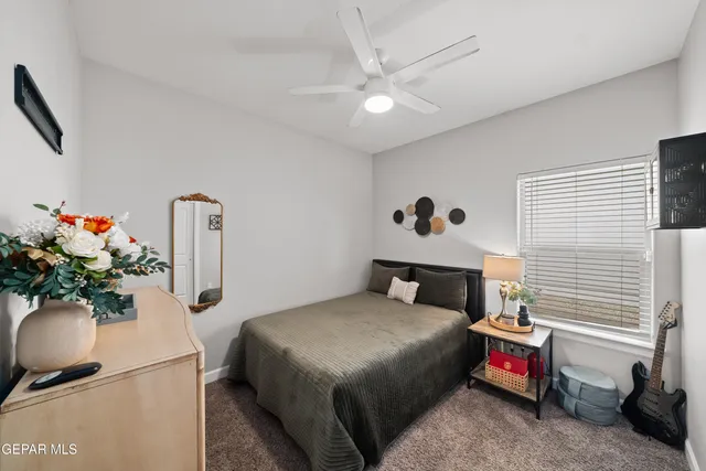 a bathroom with a sink vanity mirror and toilet
