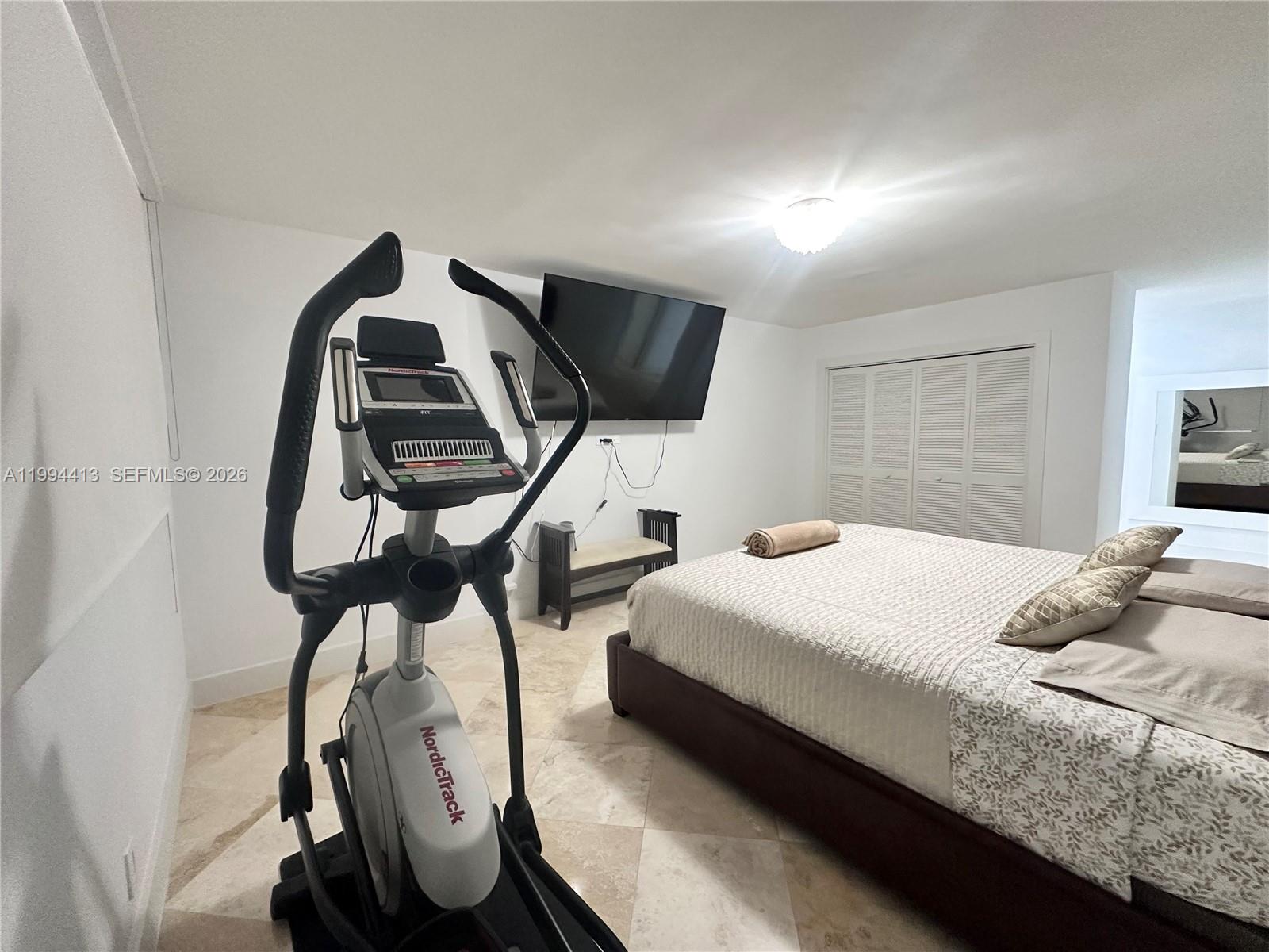 9225 Collins Avenue, Unit 1111 Surfside, FL 33154 - Photo 26 of 54 a bedroom with double bed and window