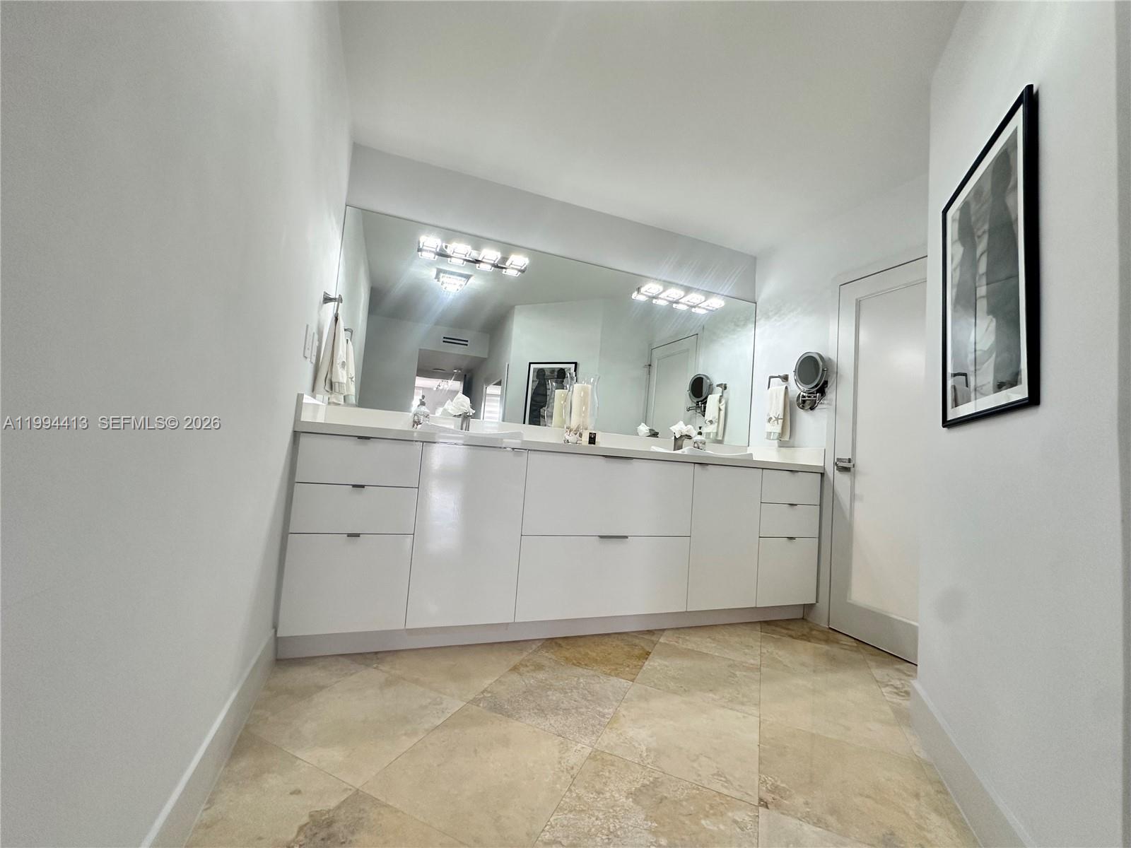 9225 Collins Avenue, Unit 1111 Surfside, FL 33154 - Photo 28 of 54 a view with cabinets and window