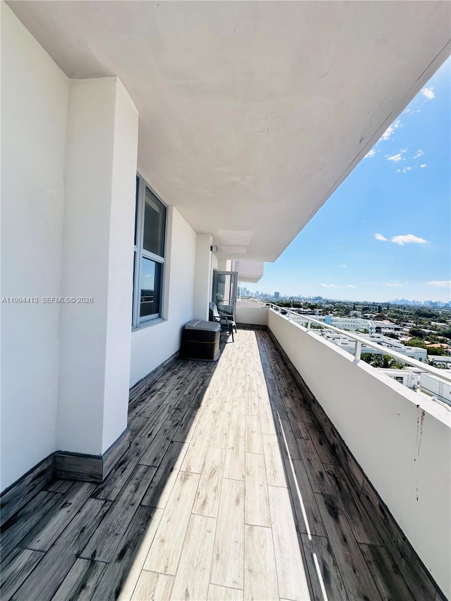 9225 Collins Avenue, Unit 1111 Surfside, FL 33154 - Photo 35 of 54 a view of an empty room with wooden floor