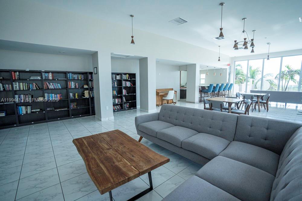 9225 Collins Avenue, Unit 1111 Surfside, FL 33154 - Photo 43 of 54 a living room with furniture and wooden floor