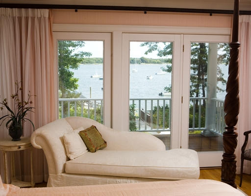 979-0 Old Post Road Barnstable, MA 02635 - Photo 8 of 10 a large white bed sitting in a bedroom next to a window