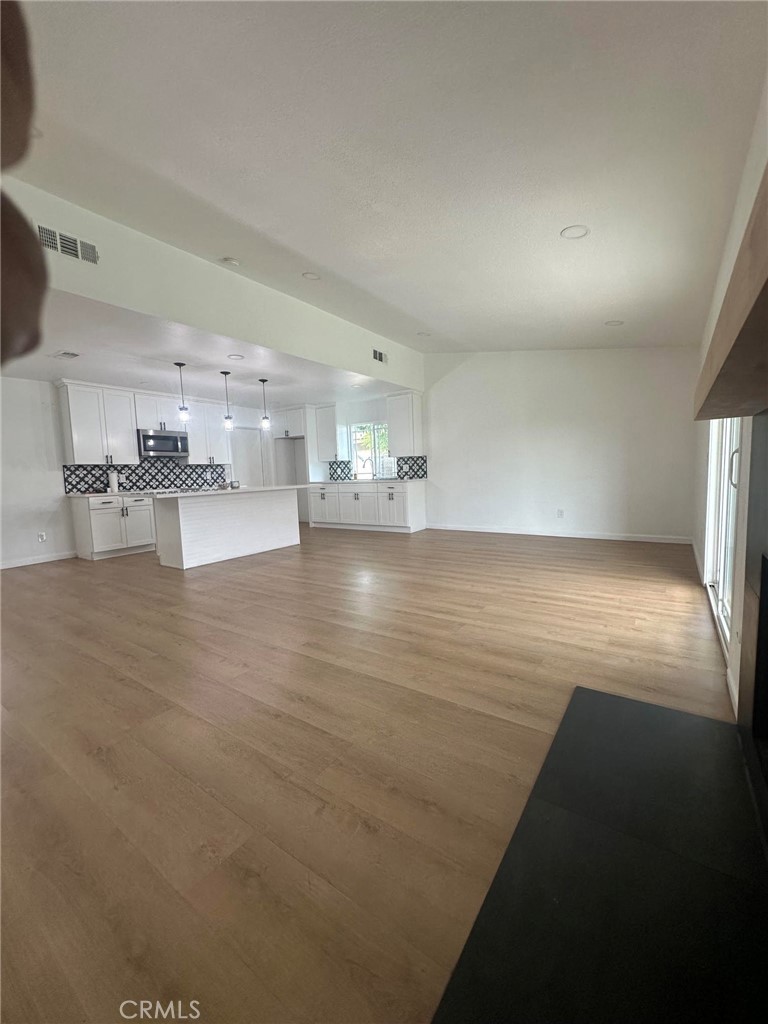 2014 Iris Way Hemet, CA 92545 - Photo 3 of 10 a view of empty room with wooden floor