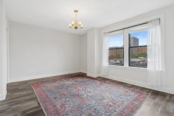 a view of an empty room with a window