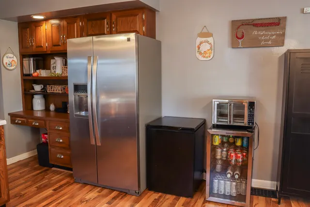 a kitchen with metallic refrigerator freezer and a dishwasher
