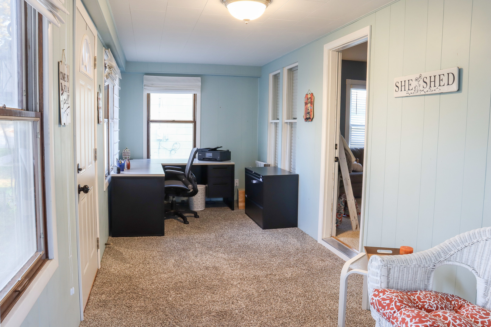 102 South Jackson Street Morrison, IL 61270 - Photo 2 of 29 a view of a workspace with furniture and a window