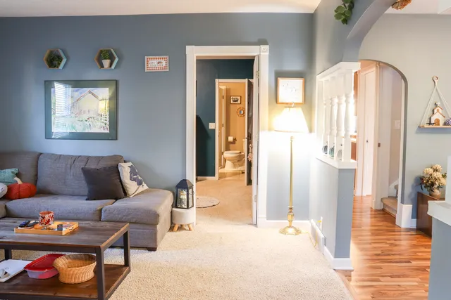 a bedroom with furniture and a wooden floor