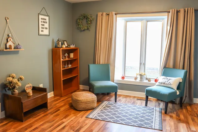 a living room with furniture and a window