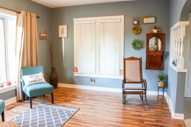 a living room filled with furniture and a window