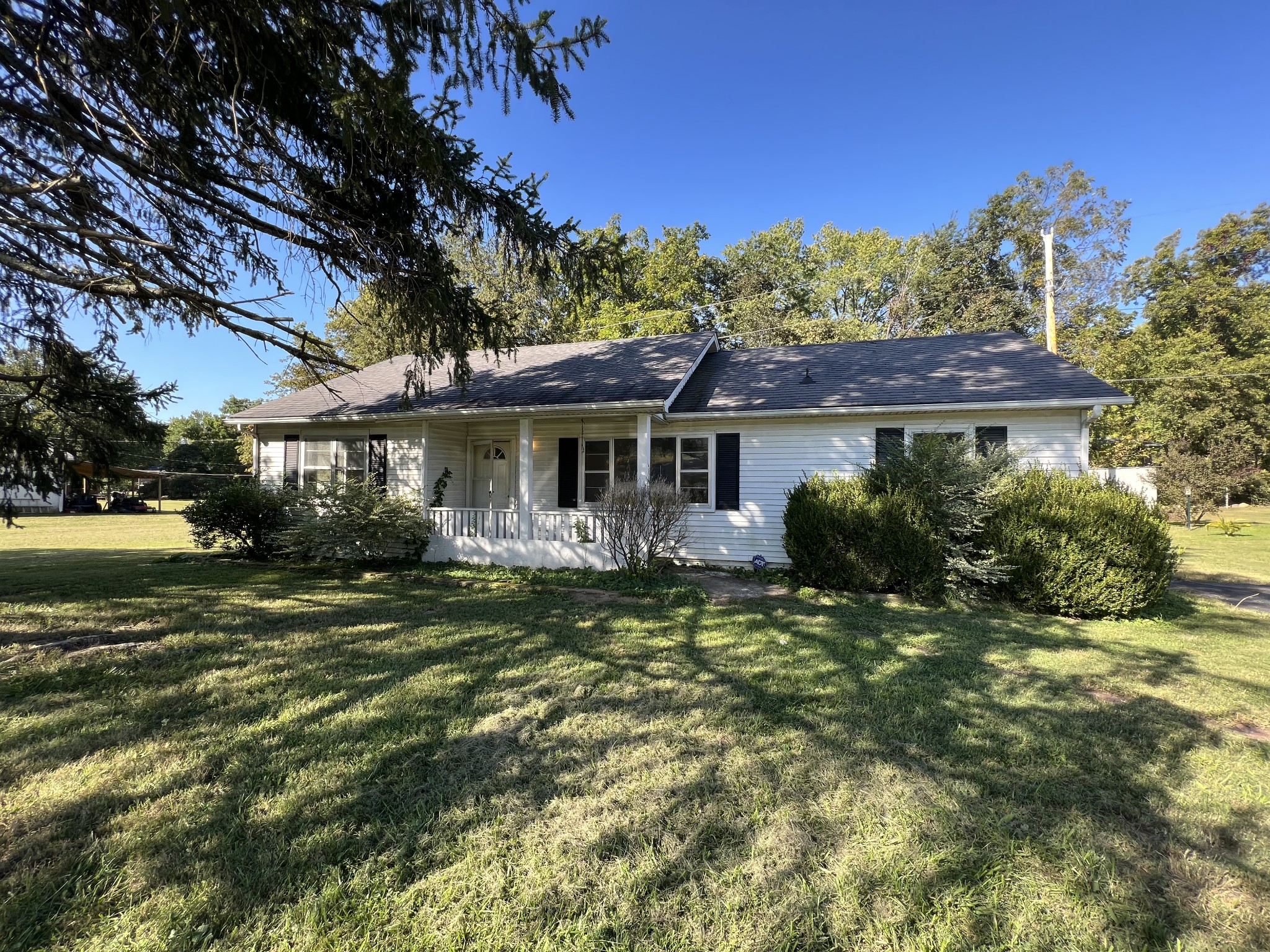 1255 Main Street Pleasant View, TN 37146 - Photo 1 of 14 a front view of a house with a yard