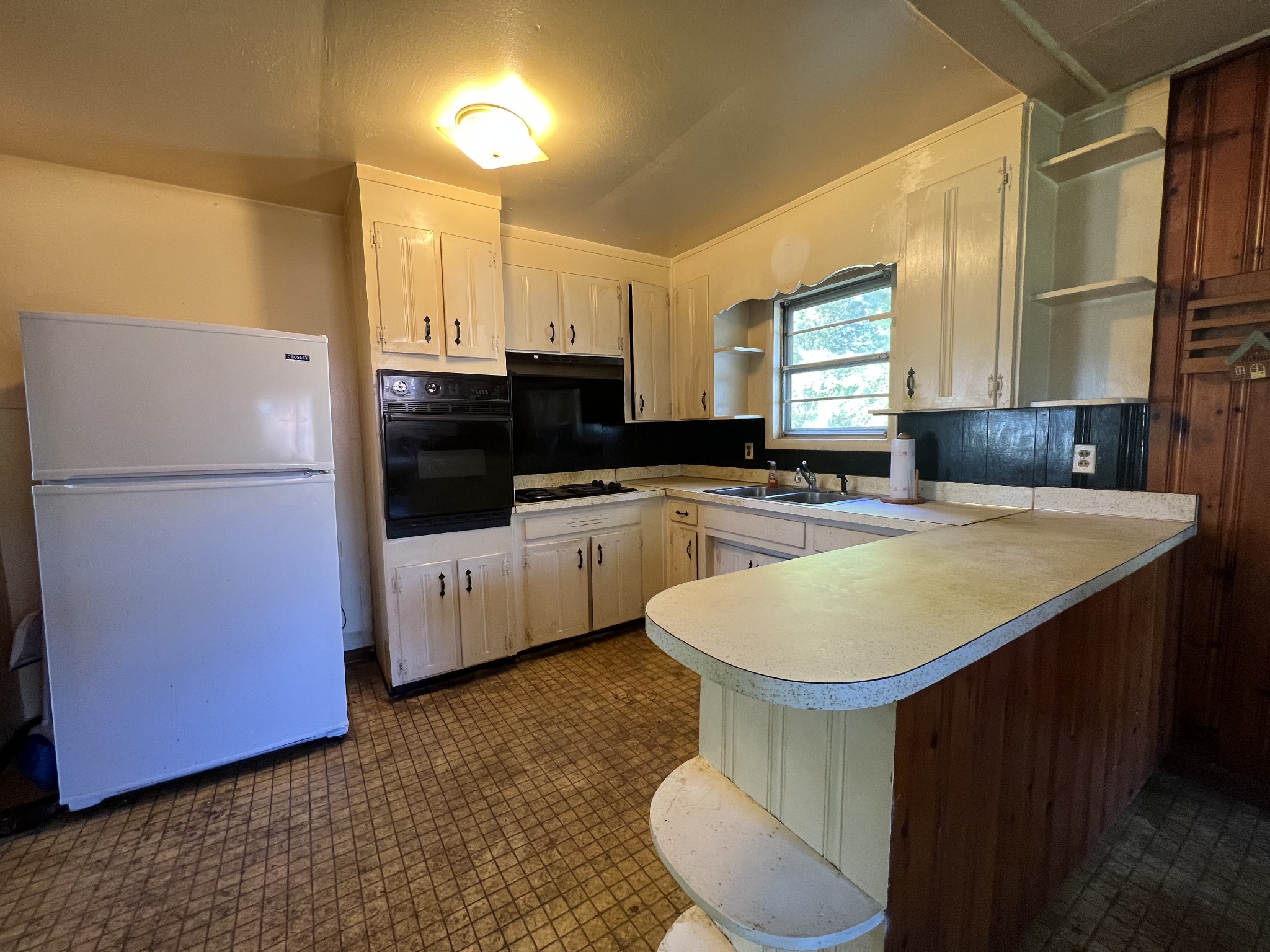 1255 Main Street Pleasant View, TN 37146 - Photo 13 of 14 a kitchen with stainless steel appliances granite countertop a sink a stove a refrigerator a counter top space and cabinets
