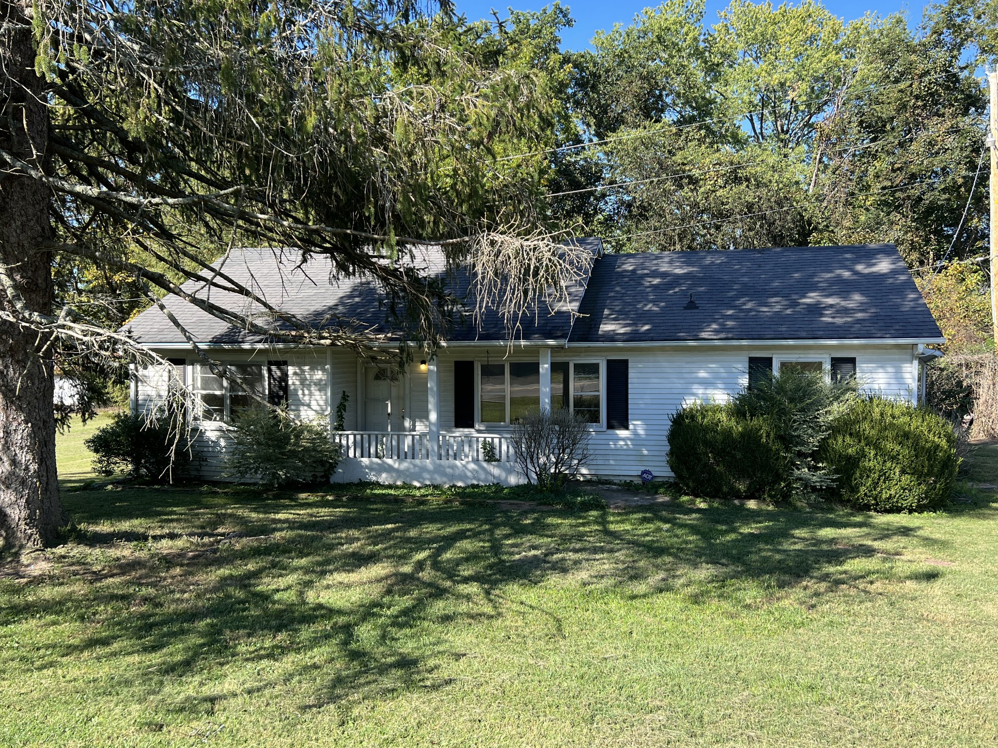 1255 Main Street Pleasant View, TN 37146 - Photo 2 of 14 a front view of a house with a yard