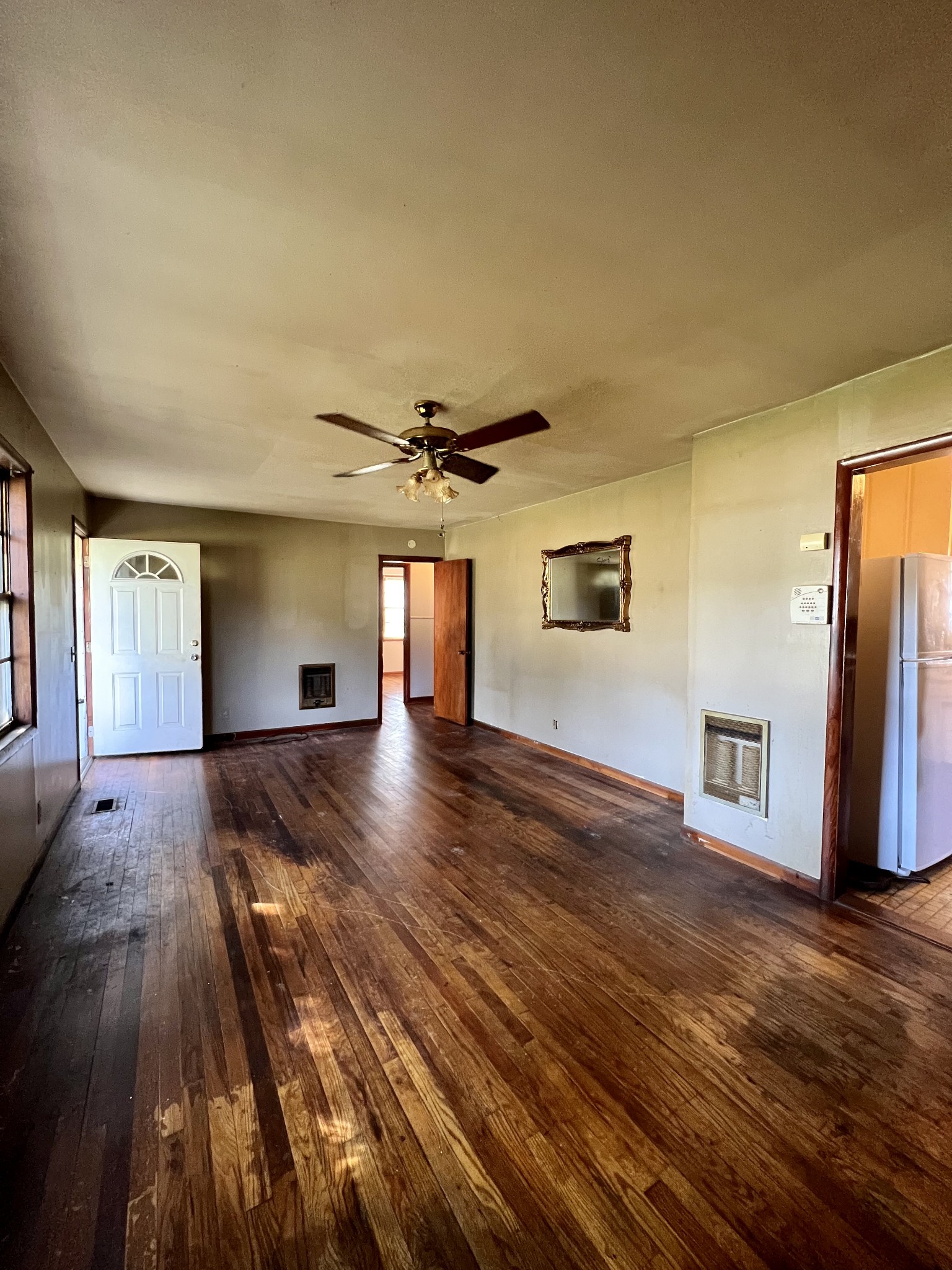 1255 Main Street Pleasant View, TN 37146 - Photo 7 of 14 a view of an empty room with window and wooden floor
