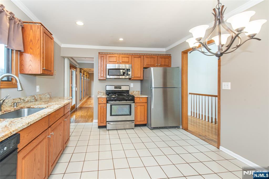1 Old Timber Court Roxbury Township, NJ 07847 - Photo 11 of 34 a kitchen with stainless steel appliances a refrigerator sink and stove
