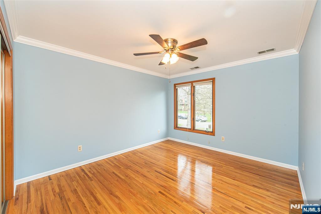 1 Old Timber Court Roxbury Township, NJ 07847 - Photo 13 of 34 a view of a big room with wooden floor and a chandelier fan