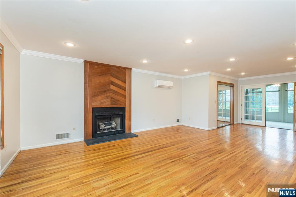 1 Old Timber Court Roxbury Township, NJ 07847 - Photo 18 of 34 a view of an empty room with wooden floor fireplace and a window