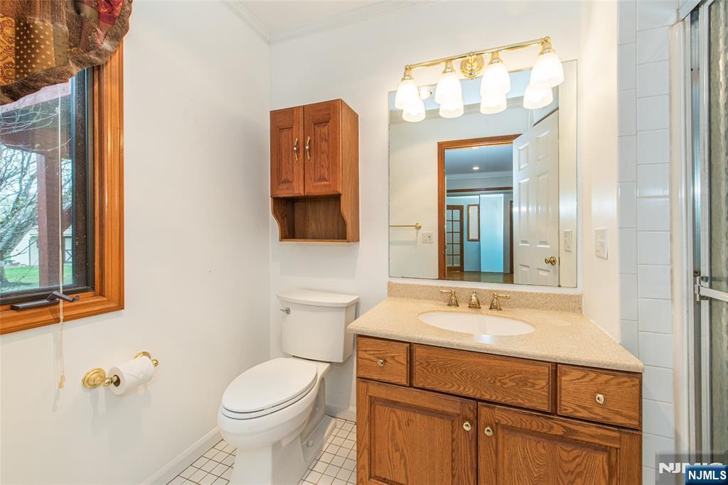 1 Old Timber Court Roxbury Township, NJ 07847 - Photo 20 of 34 a bathroom with a sink toilet and mirror