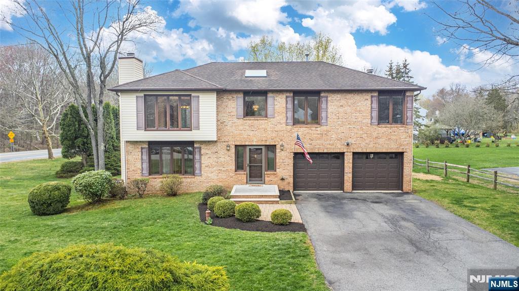 1 Old Timber Court Roxbury Township, NJ 07847 - Photo 26 of 34 a front view of a house with a garden and yard