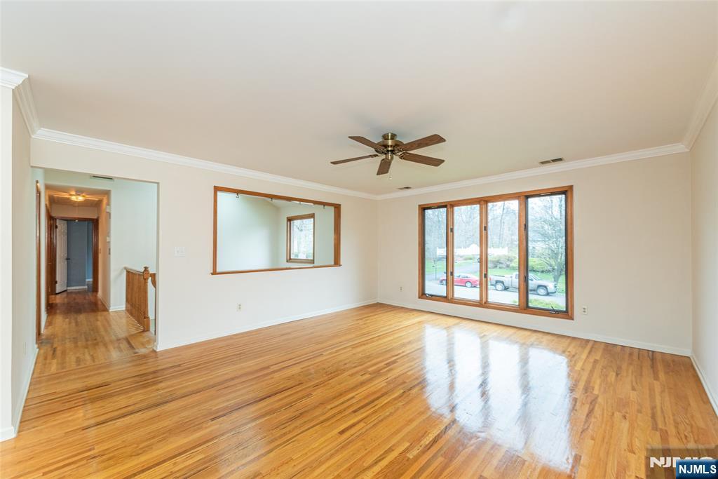 1 Old Timber Court Roxbury Township, NJ 07847 - Photo 6 of 34 a view of an empty room with wooden floor and a window