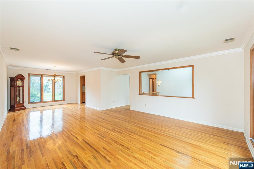 1 Old Timber Court Roxbury Township, NJ 07847 - Photo 8 of 34 a view of an empty room with wooden floor and a window