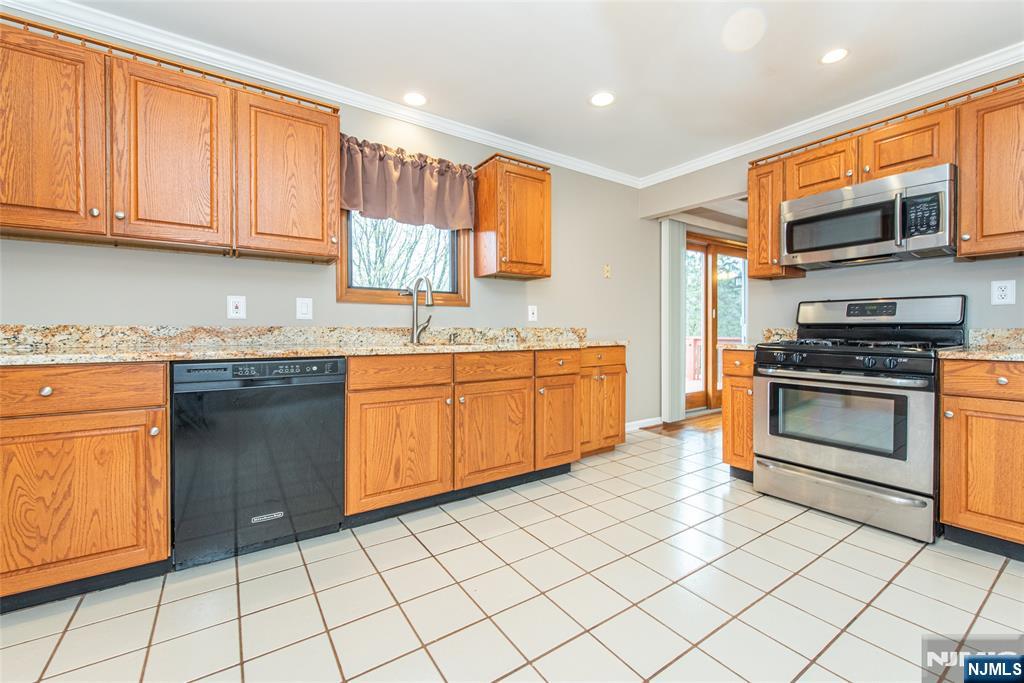 1 Old Timber Court Roxbury Township, NJ 07847 - Photo 10 of 34 a kitchen with stainless steel appliances granite countertop a stove a sink and a microwave