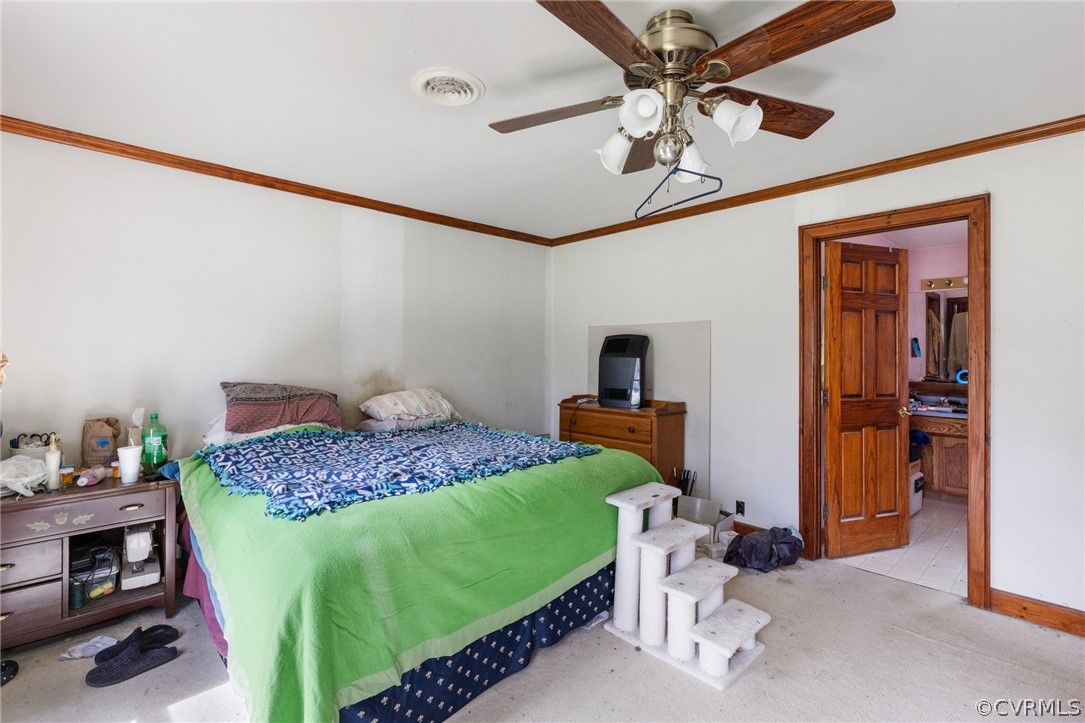 8442 Wheeling Road Mechanicsville, VA 23116 - Photo 14 of 23 a bedroom with a bed and a chandelier