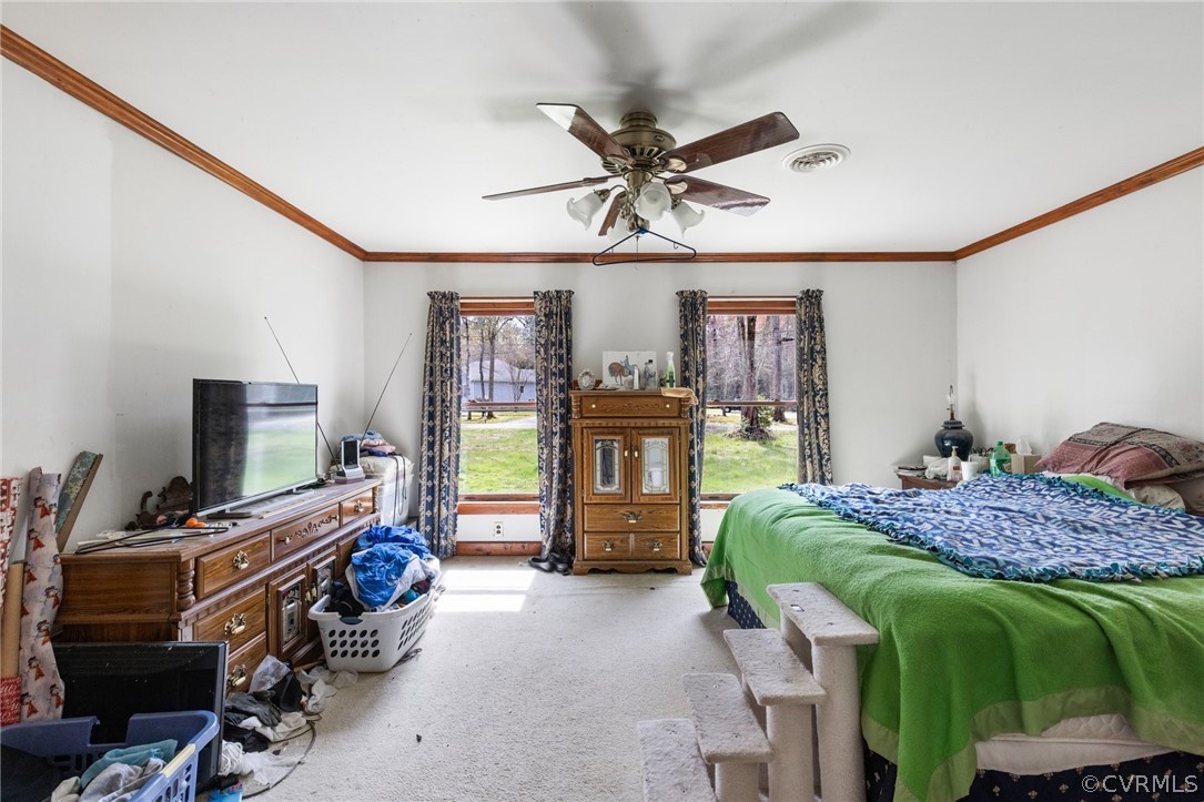 8442 Wheeling Road Mechanicsville, VA 23116 - Photo 16 of 23 a bedroom with a bed and a flat tv screen