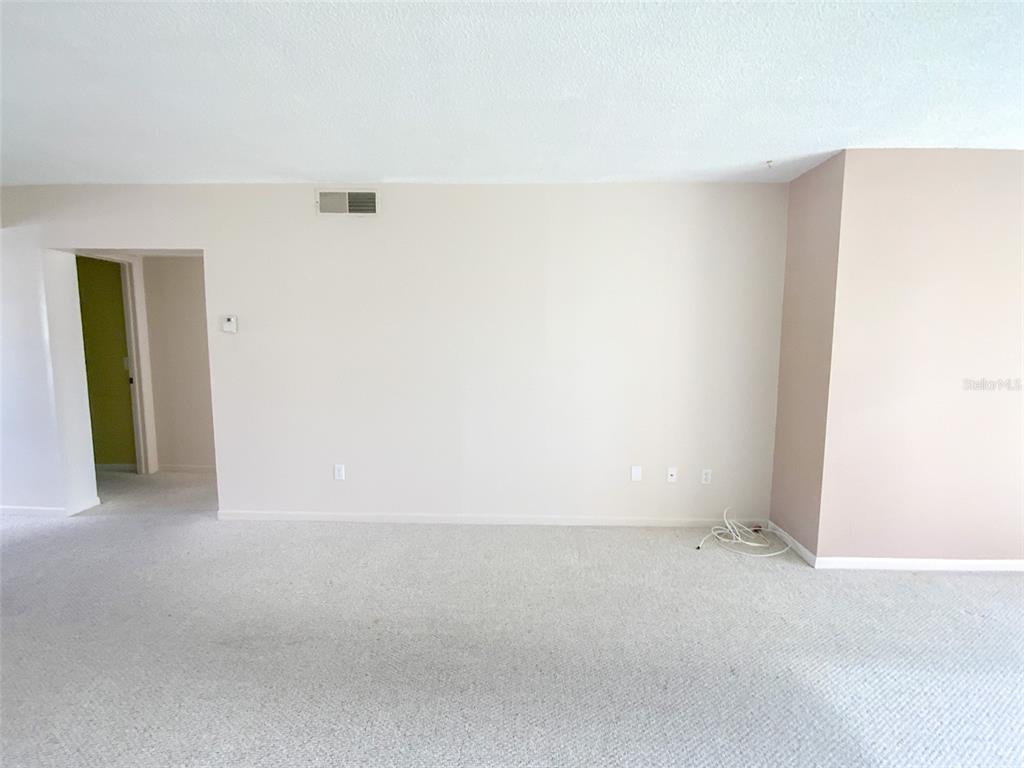 1370 Heather Ridge Boulevard, Unit 204 Dunedin, FL 34698 - Photo 11 of 37 an empty room with closet