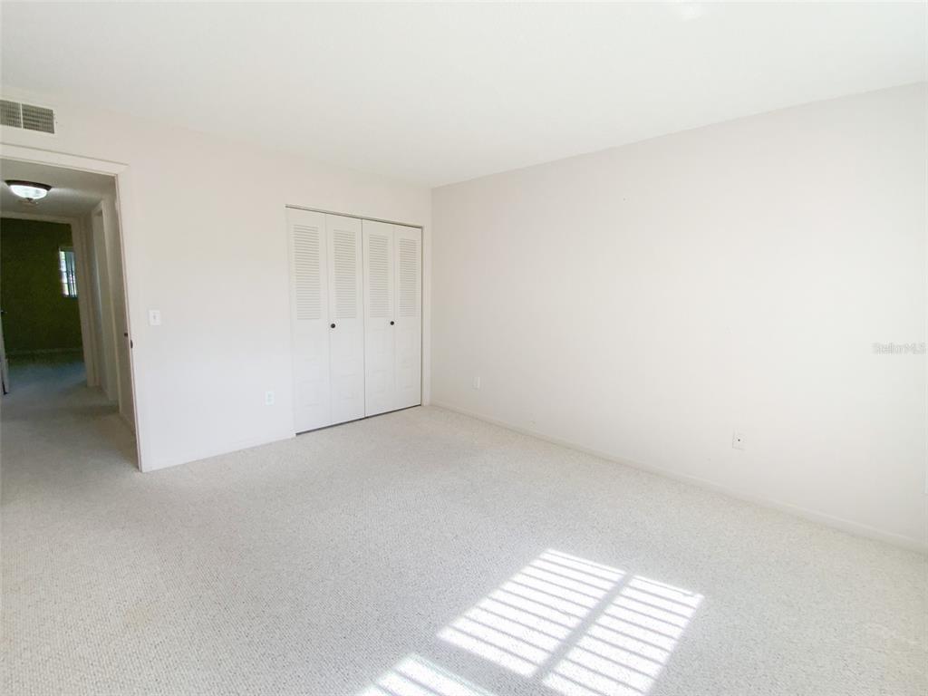 1370 Heather Ridge Boulevard, Unit 204 Dunedin, FL 34698 - Photo 15 of 37 a view of an empty room