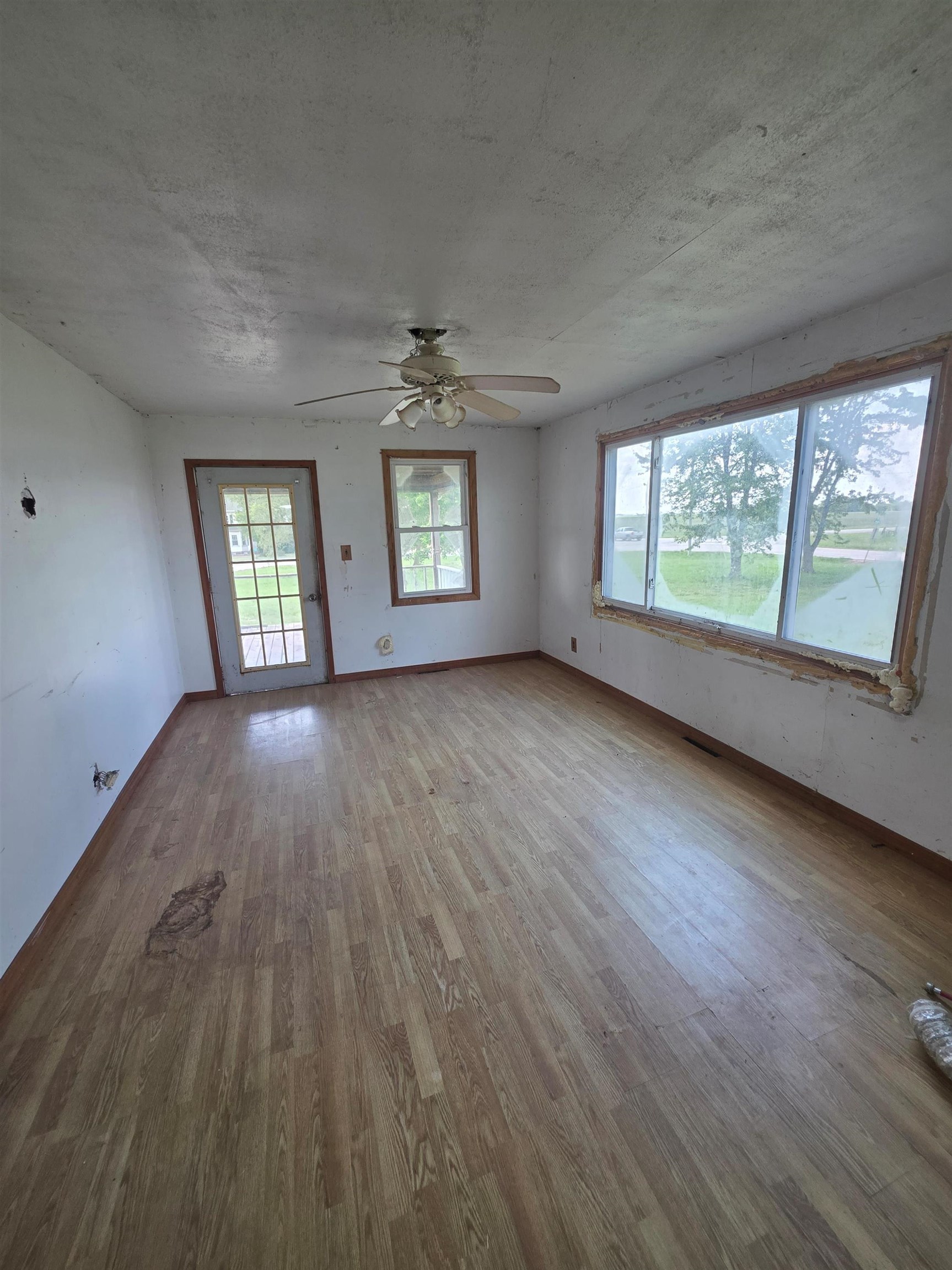 903 Sterling Road Dixon, IL 61021 - Photo 12 of 24 a view of an empty room with wooden floor and windows