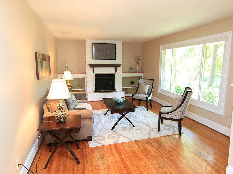 4700 Rembert Drive Raleigh, NC 27612 - Photo 2 of 16 Move In Condition! Living Rm w/brick hearth and fireplace. Hardwood Flooring. Custom shelving. Smooth Ceilings. Living Rm