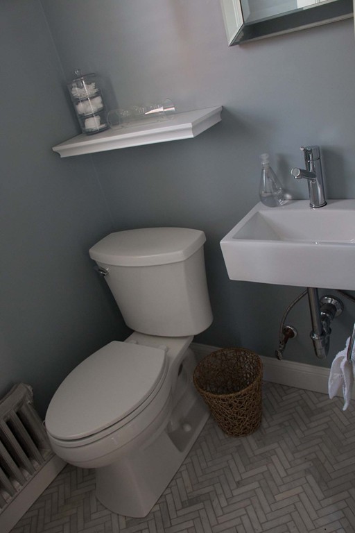 25 Havelock Road Worcester, MA 01602 - Photo 23 of 28 a white toilet sitting next to a bathroom sink