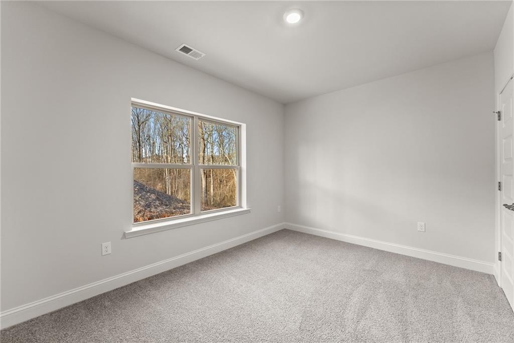 484 Magnolia Grove Place Cornelia, GA 30531 - Photo 18 of 35 an empty room with a window