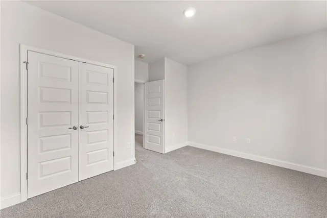 an empty room with closet area