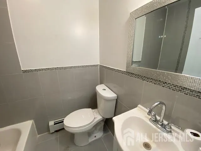 a bathroom with a sink and a toilet