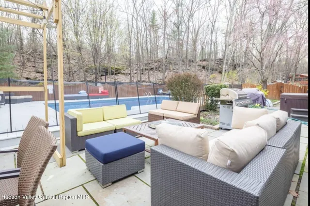 a view of a patio with couches and a fire pit