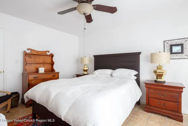 a bedroom with a bed and a closet