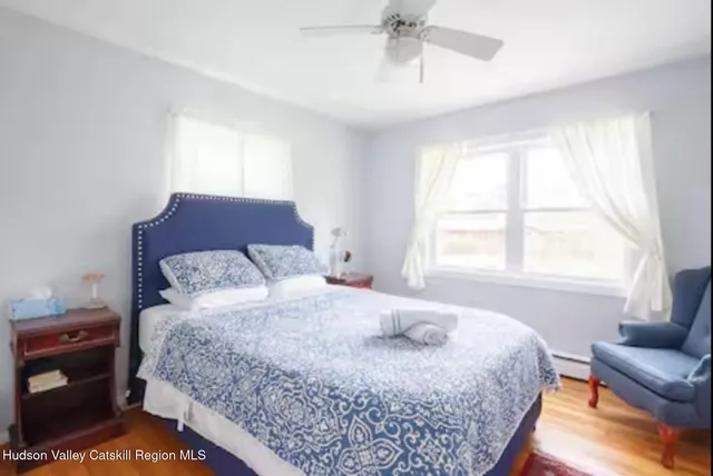 a bedroom with a large bed and a couch