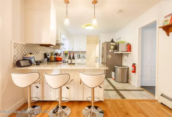 a very nice looking dining room with a table and chairs