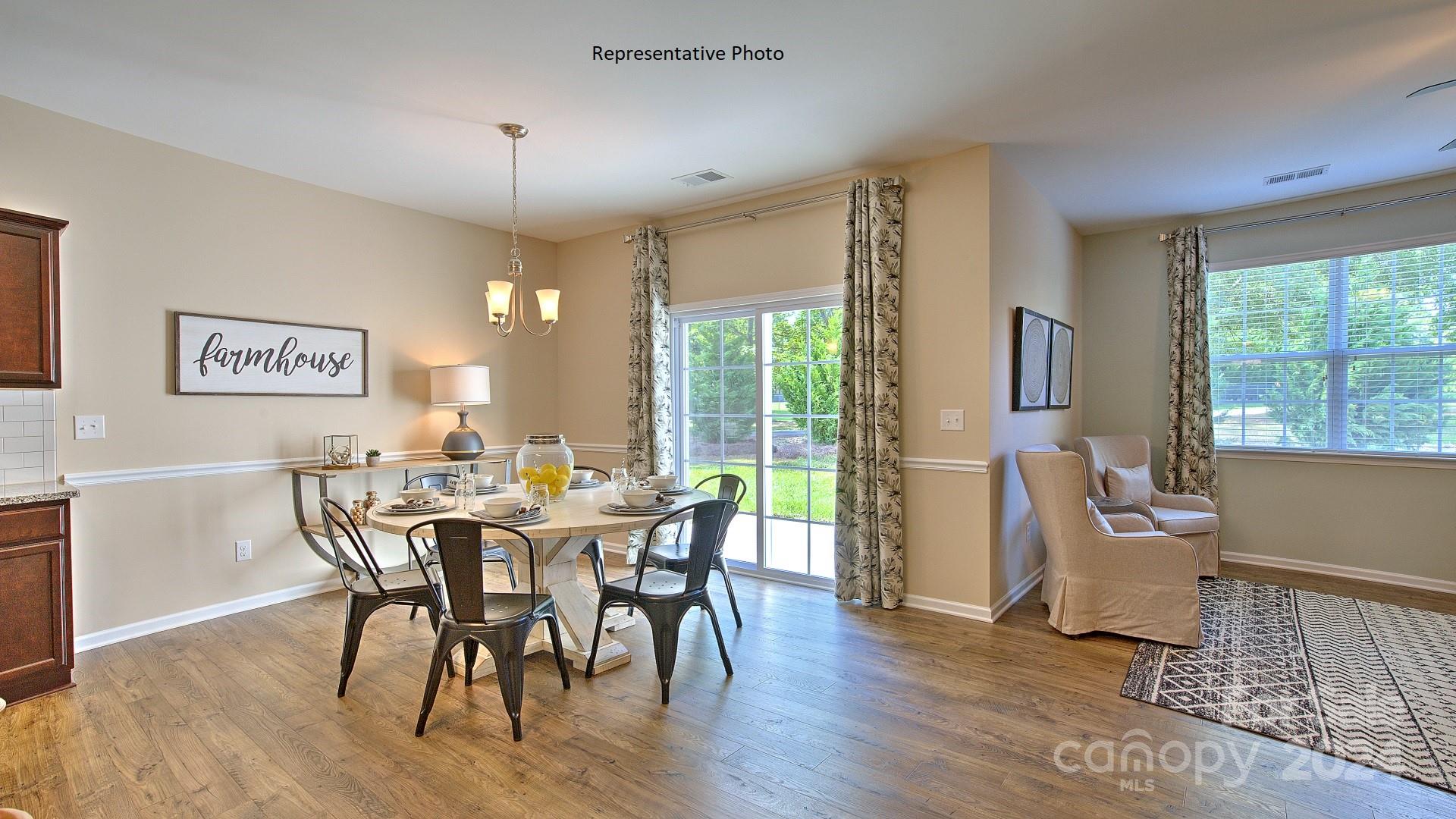 3779 Charles Street Northwest Conover, NC 28613 - Photo 11 of 36 a view of a dining room with furniture window and wooden floor