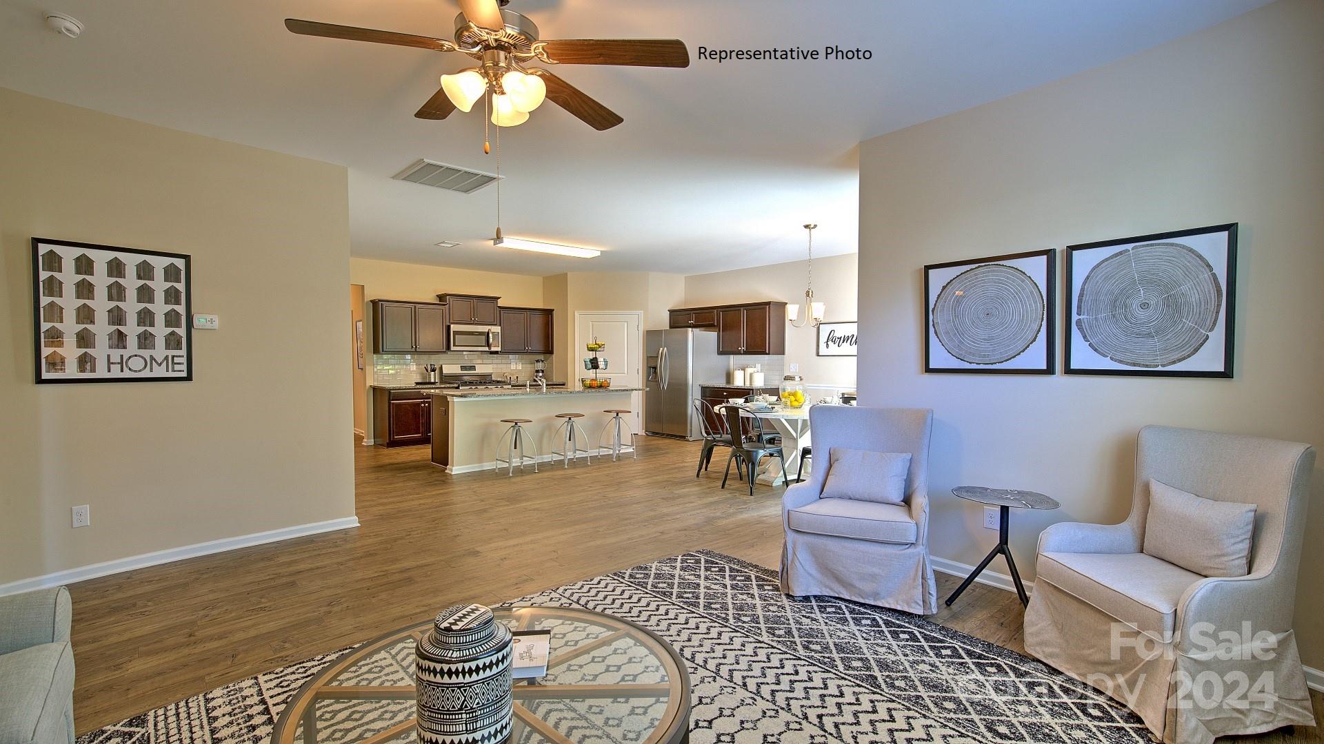 3779 Charles Street Northwest Conover, NC 28613 - Photo 18 of 36 a living room with furniture and kitchen view